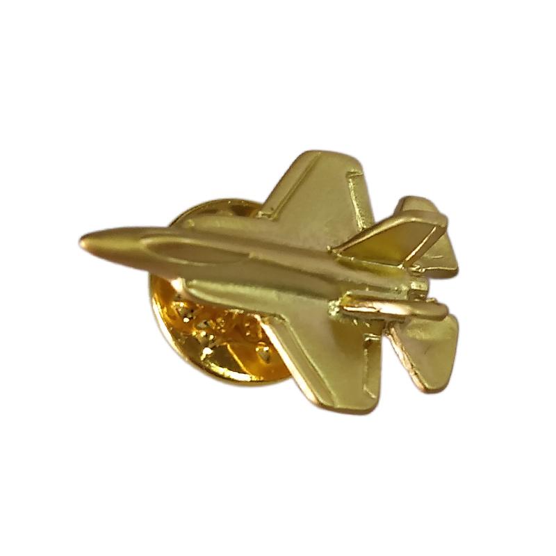 Gold pin badge